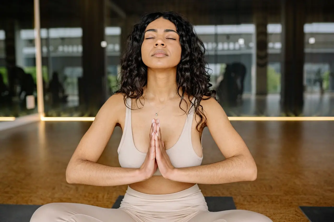 Serene woman meditating in a luxurious yoga studio environment